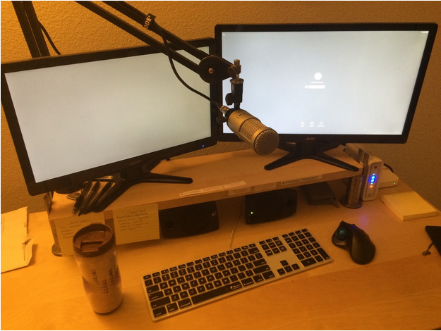 Jonathan Gonzales' workspace with a cup of puerh tea
